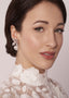 crystal flower and pearl stud earring in silver on model in lace dress side view