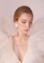 Ivory Silk flower and oversized pearl earring on model in tulle dress