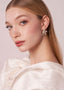 Swarovski crystal and pearl left right earring design on model side view