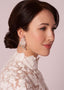 silk and crystal floral stud earring in model in lace dress side view