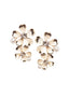 Double flower and pearl gold stud earring on white background