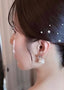 Crystal and oversized pearl stud earring on bride with pearl hairpins