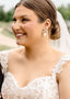 crystal flower and pearl stud earring in silver on bride with veil