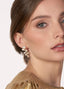 Golden Swarovski crystal and pearl left right earring on model side view