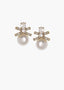 Pair of pearl earrings with gold accents and clear gemstones on a white background