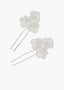 Floral hairpins with pearls on a white background