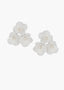 White floral earrings with pearl centers on a white background